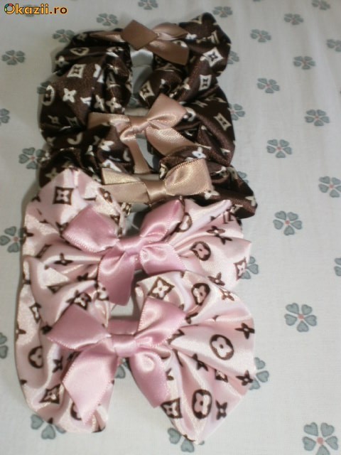CLAME LOUIS VUITTON foto mare